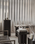Modern interior with dark furniture and light curtains from 101 Copenhagen