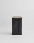 Rectangular pedestal plinth with a coffee colour finish on a light gray background from 101 Copenhagen at Spacio retail stores in Mumbai & Kolkata.