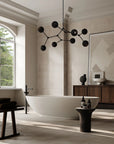 Modern bathroom with a freestanding bathtub, wooden cabinet, and decorative lighting fixture.