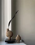 Two ceramic vases on a windowsill with a plain wall background from 101 Copenhagen at Spacio retail stores in Mumbai & Kolkata.