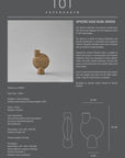 Ceramic vase with product information on a gray background