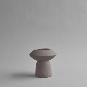 A small 101Cph Sphere Vase Fat Taupe 111172 with a taupe finish on a grey background.