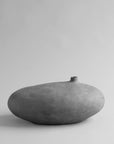 Gray ceramic vase on a light gray background from 101 Copenhagen at Spacio retail stores in Mumbai & Kolkata.