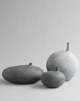 Three gray ceramic vases of different sizes on a light gray background from 101 Copenhagen at Spacio retail stores in Mumbai & Kolkata.