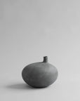 Gray ceramic vase on a light gray background from 101 Copenhagen at Spacio retail stores in Mumbai & Kolkata.