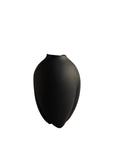 Black vase on a white background from 101 Copenhagen at Spacio retail stores in Mumbai & Kolkata.