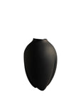 Black vase on a white background from 101 Copenhagen at Spacio retail stores in Mumbai & Kolkata.