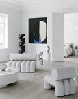Modern living room with white furniture and abstract art