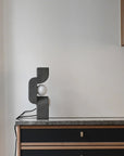 Modern lamp on a sideboard against a plain wall from 101 Copenhagen at Spacio retail stores in Mumbai & Kolkata.