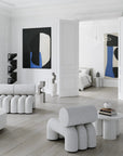 Modern living room with white furniture and abstract art