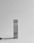 Rectangular mirror with a black power cord on a white background from 101 Copenhagen at Spacio retail stores in Mumbai & Kolkata.