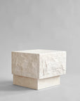 Side view of Rectangular limestone plinth on a gray background from 101 Copenhagen at Spacio retail stores in Mumbai & Kolkata.