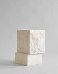 Side view of a tall limestone plinth from 101 Copenhagen at Spacio retail stores in Mumbai & Kolkata.