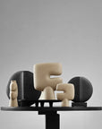 Set of abstract ceramic sculptures on a gray background from 101 Copenhagen at Spacio retail stores in Mumbai & Kolkata.