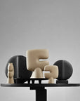 Set of abstract ceramic sculptures on a gray background from 101 Copenhagen at Spacio retail stores in Mumbai & Kolkata.