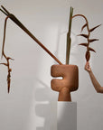 Abstract sculptural vase with organic shapes and natural elements on a white background from 101 Copenhagen at Spacio retail stores in Mumbai & Kolkata.