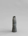 A 101Cph Tribal Vase Medio Dark Grey 214003 by 101 Copenhagen on a dark grey background. Available at Spacio India