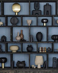 A shelf showcasing a diverse collection of 101Cph Tribal Vase Minis in various hues, including the earthy Sand color, from the exquisite 101 Copenhagen Tribal Collection. Available at Spacio India