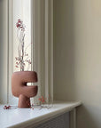 Ceramic sculptural vase with branches on a windowsill from 101 Copenhagen