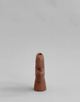 Side view of a terracotta colour ceramic vase on a light gray background from 101 Copenhagen at Spacio retail stores in Mumbai & Kolkata.