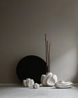 Set of white ceramic vases on a neutral background from 101 Copenhagen at Spacio retail stores in Mumbai & Kolkata.