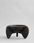 Black ceramic bowl with unique design on a light gray background from 101 Copenhagen at Spacio retail stores in Mumbai & Kolkata.