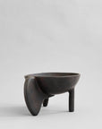 Black ceramic bowl with unique design on a light gray background from 101 Copenhagen at Spacio retail stores in Mumbai & Kolkata.