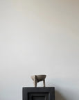 Small ceramic bowl on a black pedestal against a plain white wall from 101 Copenhagen at Spacio retail stores in Mumbai & Kolkata.