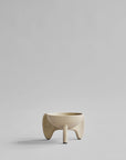 Beige ceramic planter on a light gray background from 101 Copenhagen at Spacio retail stores in Mumbai & Kolkata.