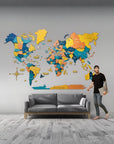 3XL size wooden world map on a grey wall above a grey colour sofa