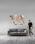 Man standing next to a gray sofa with a large size world map wall decoration on a gray wall.