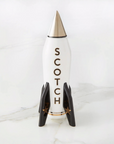 Jonathan Adler Rocket Scotch Decanter with silver pointed top and black star-accented fins, high-fired porcelain, available at Spacio India