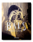 A woman wearing an Assouline Coffee Table Book Bals: Legendary Costume Balls of the Twentieth Century costume party mask.