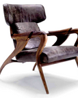 The Agrippa Isadora Lounge Chair blends Nordic design influences with modern style, featuring a wooden frame and luxurious leather upholstery.