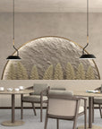 A room with 2 tables and chairs with backdrop of a stone wall with trees and pendant lamps hanging from ceiling.