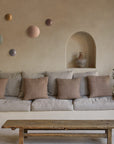 Different colour disc wall lights above a sofa in a modern theme living room.