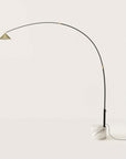 A modern design floor lamp in marble and metal on light cream colour background