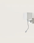 A wall light with white fabric shared on a light cream colour background