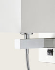 Close up of a wall light with white fabric shared on a light cream colour background