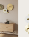Modern wall-mounted light fixtures on a neutral wall with a wooden cabinet below.