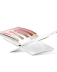 Side angle of Transparent Assouline Bookstand with a Book on a white background at Spacio India for luxury home decor collection of Coffee Table Books.