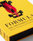 Book titled 'Formula 1: The Impossible Collection' with a red racing car on a yellow background