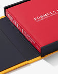 Red and black book titled 'Formula 1: The Impossible Collection' on a white background