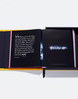 Open book with text and a car illustration on a white background