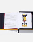 Open book with a racing car illustration on a white background