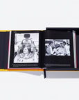 Open book with black and white photos on a white background