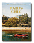 The Assouline Coffee Table Book Paris Chic with a boat on the water.