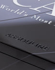 Assouline book with embossed logo on a dark surface