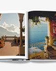 Interior spread from Assouline Dolce Vita luxury travel book capturing picturesque Mediterranean terraces with vibrant blooms and sea views, available from Spacio India.