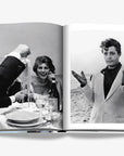 Exclusive black-and-white photographs from Dolce Vita coffee table book by Assouline, capturing Italian celebrities enjoying authentic Italian cuisine, offered by Spacio India.